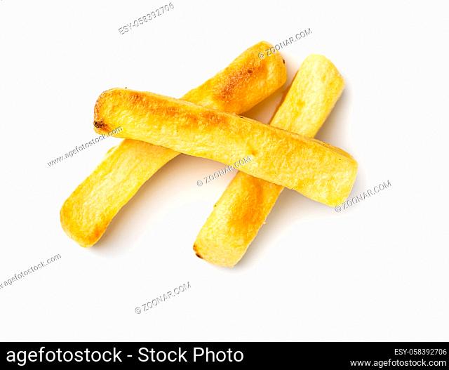Big french fries. Fried potato chips isolated on white background