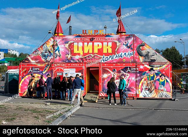 PETROPAVLOVSK KAMCHATSKY CITY, KAMCHATKA PENINSULA, RUSSIA - SEP 22, 2018: Summer view on tent of mobile Russian Circus Adrenaline on sunny day; spectators...