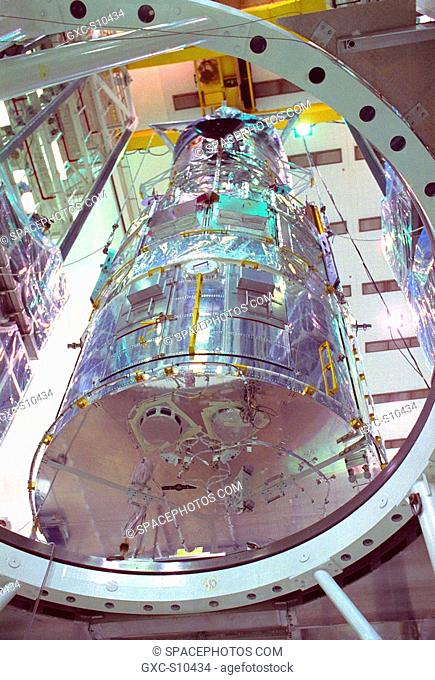 10/10/1989 -- The Hubble Space Telescope HST is lifted into the workstands in the Vertical Processing Facility as work begins at KSC to process the 94-inch...
