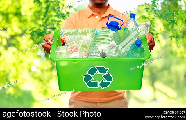 close up of young man sorting plastic waste