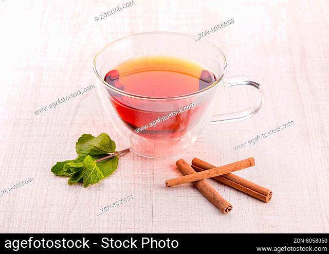 Cup of tea with cinnamon and mint