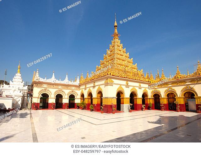 The golden pagoda and courtyard at Mahamuni Paya temple, Mandalay, Myanmar