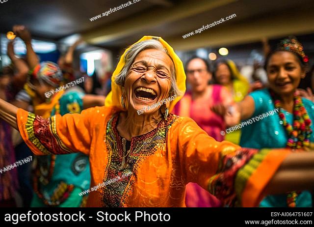 Big Family Celebrating Diwali Indian Family elderly in Traditional Clothes Gathered Together dancing having fun. Indian Moment of Happiness on a Hindu Holiday...
