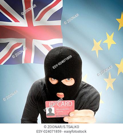 Hacker with flag on background holding ID card in hand - Tuvalu