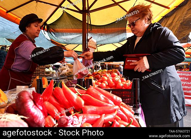 RUSSIA, SOCHI - MARCH 3, 2023: A woman shops for vegetables at a food market in Sochi's Matsesta Neighborhood. Dmitry Feoktistov/TASS