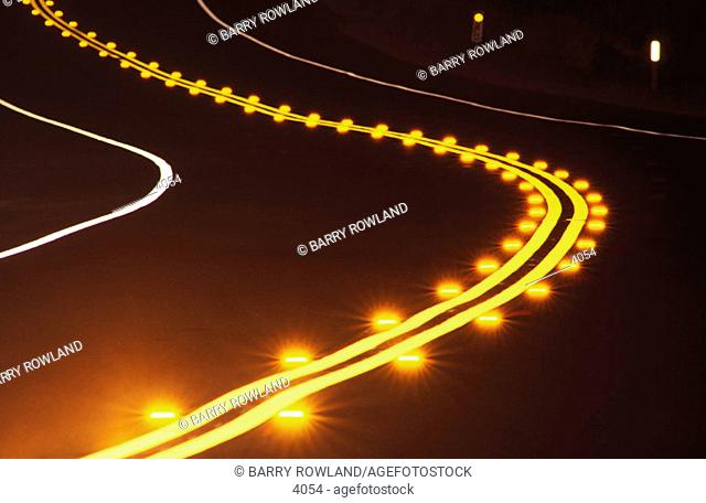 Curving road, night, illuminated reflectors