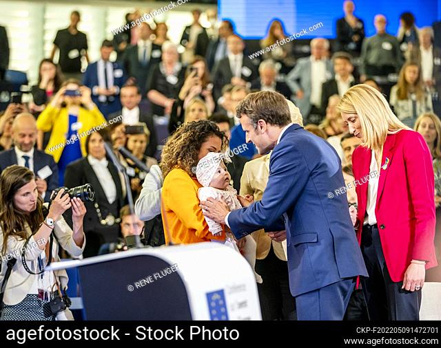 French President Emmanuel Macron and President of the European Commission Ursula Von der Leyen and European Parliament Chairman Roberta Metsola (right) great...