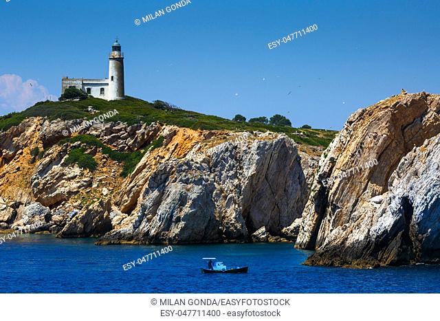 Lighthouse on Repi islet near Skiathos island, Greece.