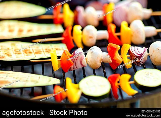 vegetables and mushrooms roasting on brazier grill