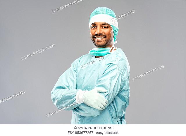indian male doctor or surgeon in protective wear