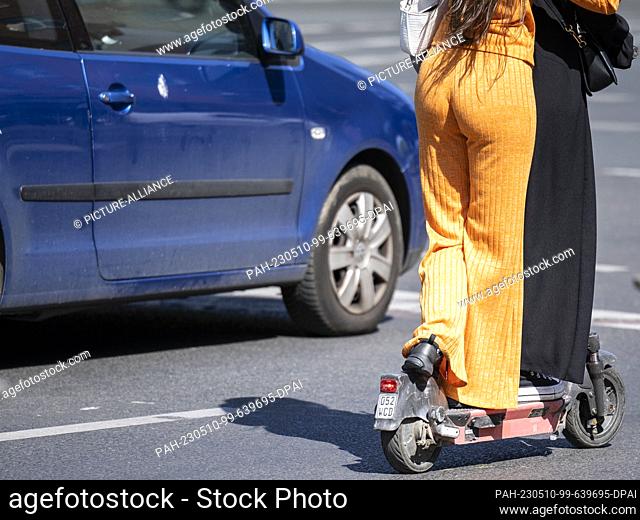10 May 2023, Berlin: Two women standing on an e-scooter. People were injured in 8260 accidents involving e-scooters last year