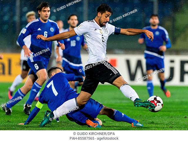 Germany's Sami Khedira (R) and Matteo Vitaioli from San Marino vie for the ball during the World Cup qualifier match between San Marino and Germany in...