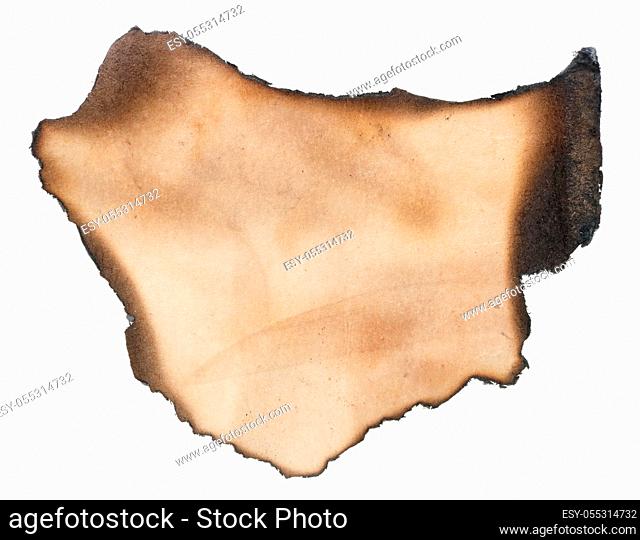 A small piece of yellowed paper with burned black edges. Isolated on white studio macro shot