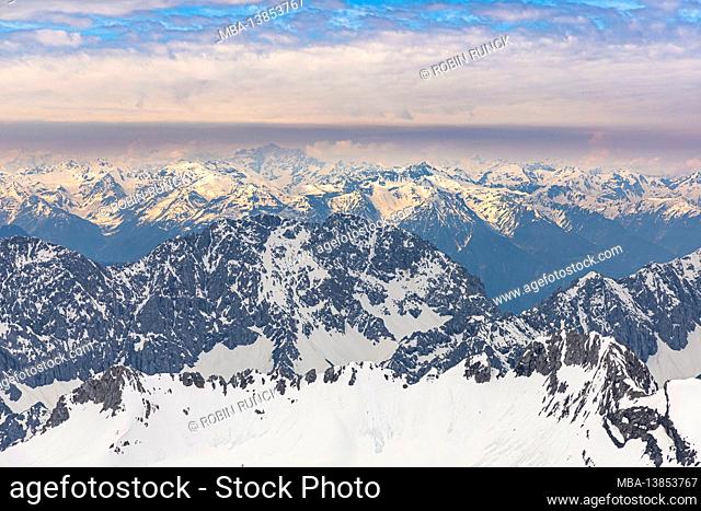 View from the Zugspitz summit to the surrounding snow-covered mountain landscape, Grainau, Upper Bavaria, Germany