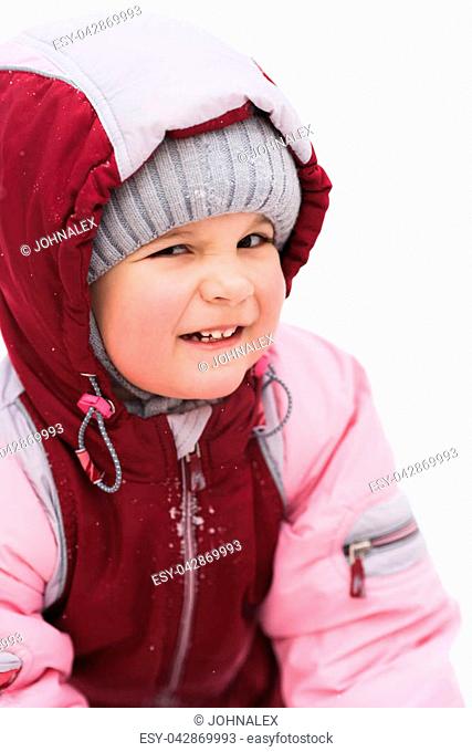 child playing in the park in winter