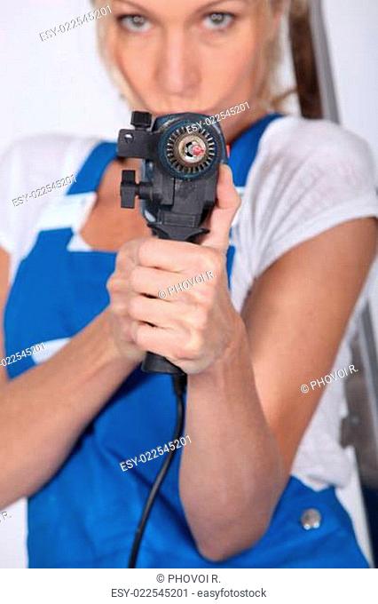 Woman armed with a power drill
