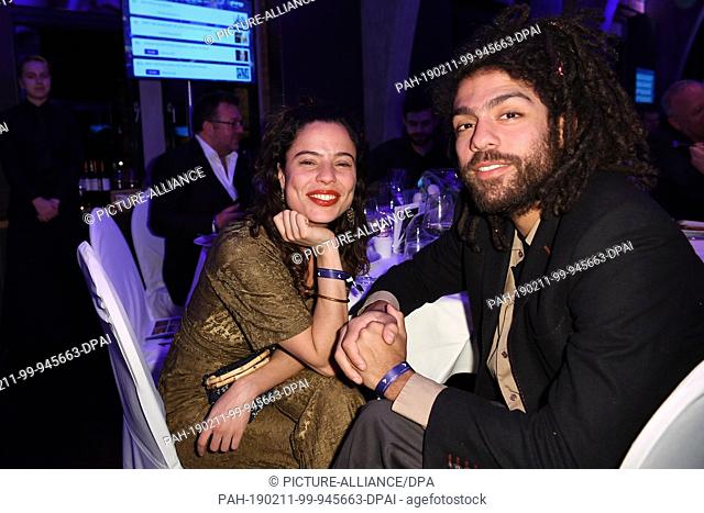 11 February 2019, Berlin: Noah Becker and his girlfriend Elizabeth Ehrlich sit at the same table at the ""Cinema for Peace Gala"" in the Westhafen Event &...