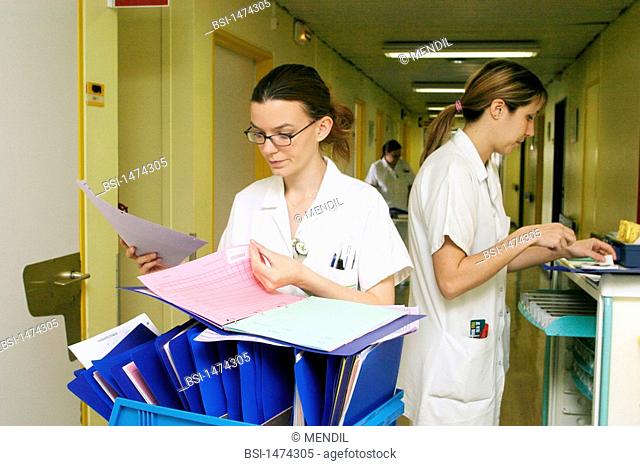 NURSE<BR>Photo essay from hospital.<BR>Sébastopol hospital in Reims, France. Nurses check patient files before administering care