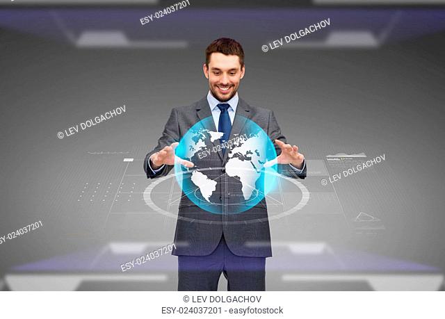 business, technology, multimedia and people concept - smiling businessman working with virtual earth globe projection