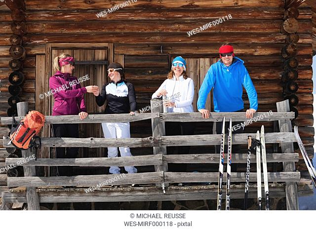 Italy, Trentino-Alto Adige, Alto Adige, Bolzano, Seiser Alm, People standing outside ski resort near railings