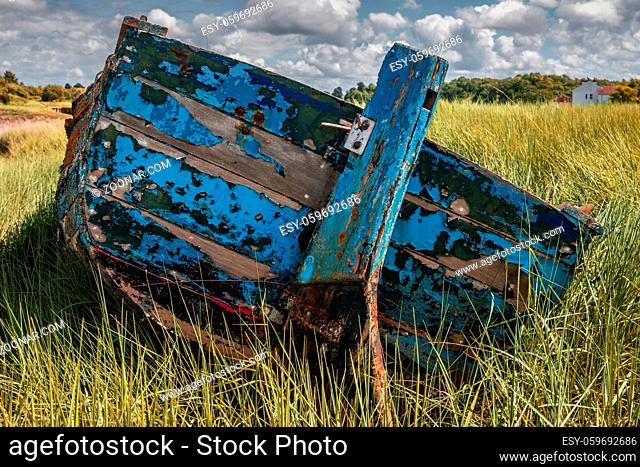 A decayed boat near the shore of the River Avon in the Pill Foreshore in Pill, North Somerset, England, UK