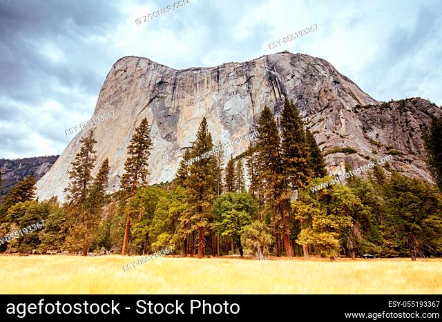 The view from within Yosemite Valley of surrounding rock faces on a stormy day in California, USA