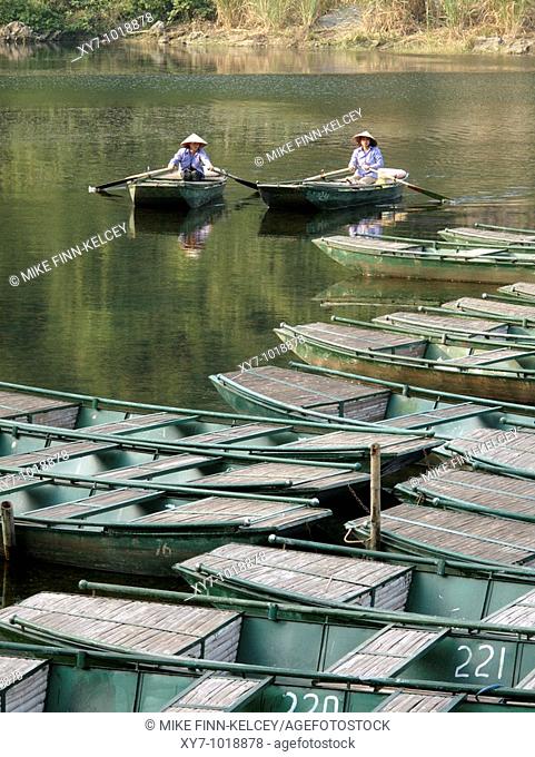 Rowing boats in the river at Tam Coc near Ninh Binh in northern Vietnam