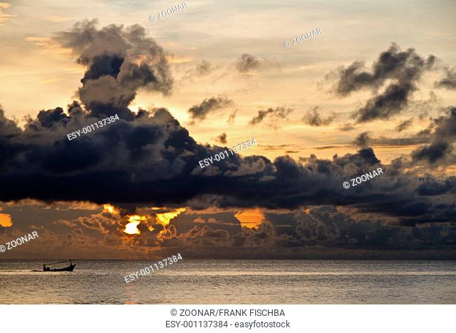Fishing boat with threatening clouds over South China Sea at Phu Quoc, Vietnam