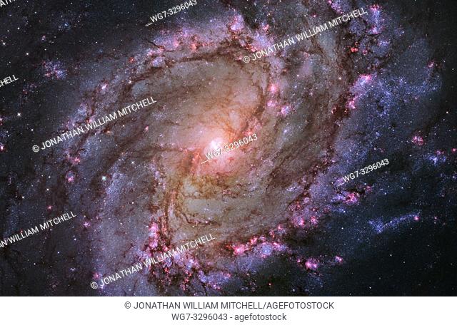 OUTER SPACE -- 09 Jan 2014 -- The vibrant magentas and blues in this Hubble Space Telescope composite image of the barred spiral galaxy M83 reveal that the...