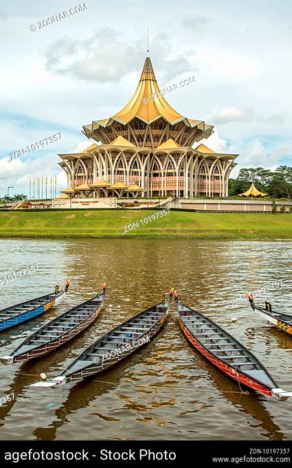 The new Parliament, Kuching, Sarawak, under the water festival in November 2016. Longboats lay on river in front of the building