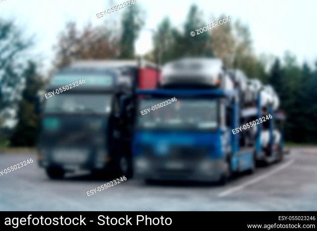 Strong blurred unrecognizable truck transport on road. Transport overpasses on the highway for the transport of orders and goods