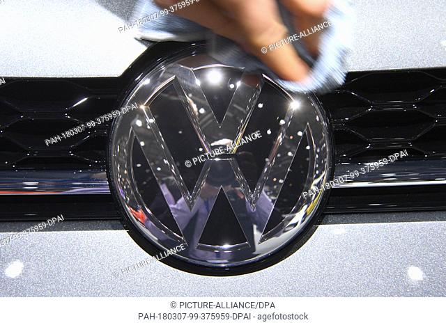 07 March 2018, Switzerland, Geneva: The logo of carmaker Volkswagen (VW) is displayed on the bonnet of an exhibited car during the 2nd Press Day at the 2018...