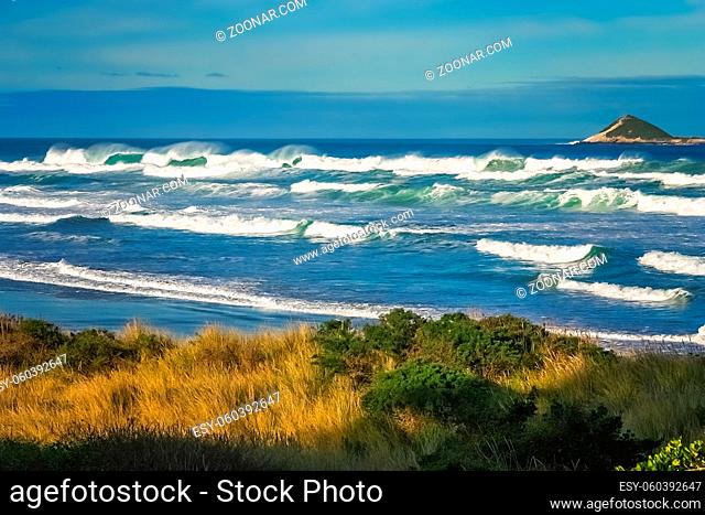Rough sea and big waves on the beach on the beautiful coastline of New Zealand South Island
