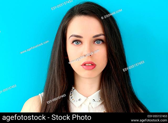 Cute, attractive woman on a blue background