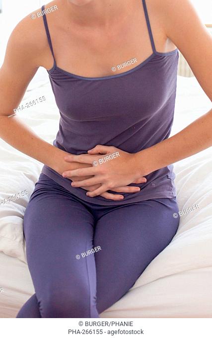 Woman suffering from abdominal pain