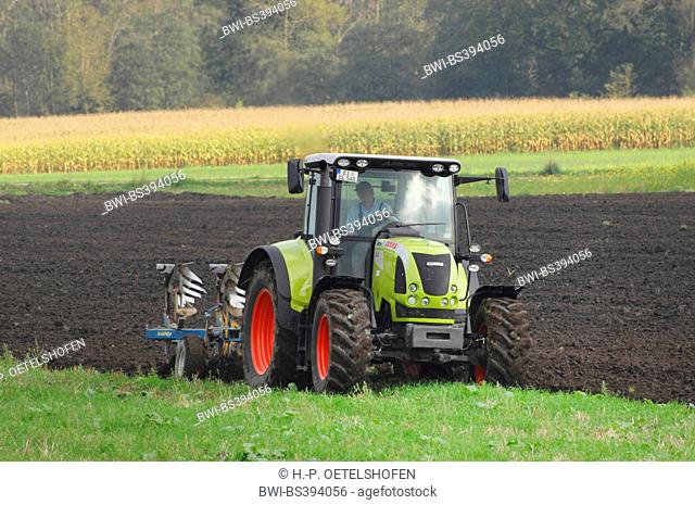 tractor ploughing a field in autumn, Germany, Bavaria