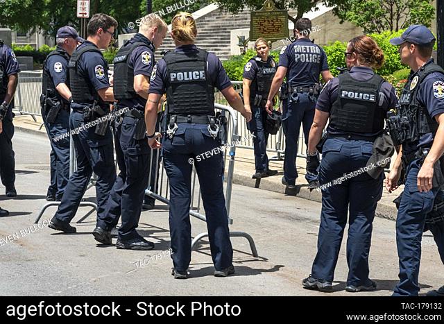 Police arranging barricades at the area of Friday night’s rioting on May 30, 2020 in Louisville, Kentucky. (Credit: Steven Bullock/The Photo Access)