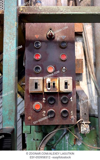 Industrial control panel in a retro style with buttons and toggle switch