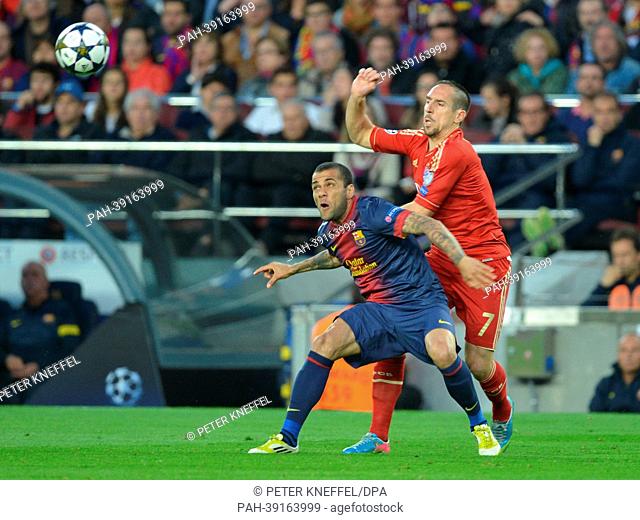 Barcelona's Daniel Alves and Munich's Franck Ribery (R) vie for the ball during the UEFA Champions League semi final second leg soccer match between FC...