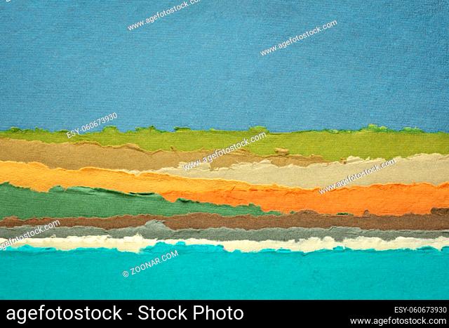 sky, sea and hills abstract landscape in blue, green and orange tones - a collection of colorful handmade Indian papers produced from recycled cotton fabric