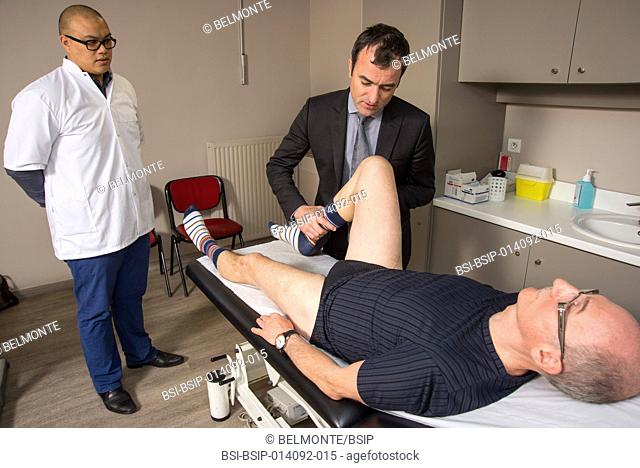 Reportage in Nollet Clinic in Paris, France. Post-op consultation (hip replacement) with Dr Nogier, a hip surgeon. Looking for pain when the hip is flexed