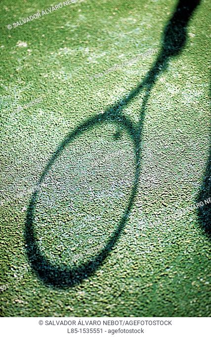 Projected shadow of a tennis racket