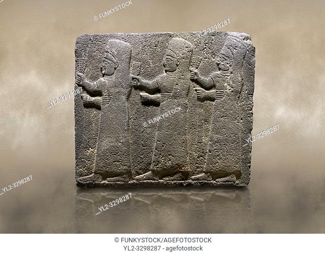 Photo of Hittite monumental relief sculpted orthostat stone panel of a Procession Basalt, Kargamis, Gaziantepe, 900 - 700 B. C