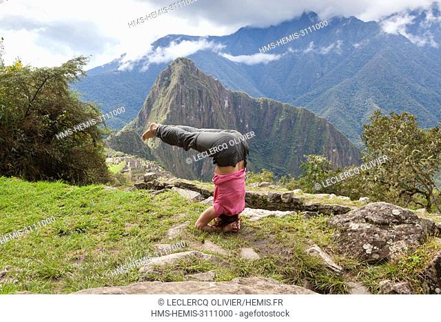 Perou, Province of Cuzco, sacred valley of the incas, Classified World Heritage of UNESCO, Woman performing a yoga posture