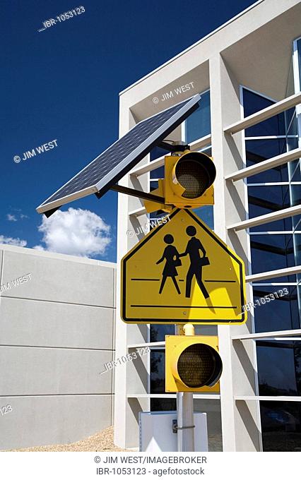 A solar panel powering school crossing warning lights at the National Renewable Energy Laboratory, operated by the US Department of Energy, Golden, Colorado