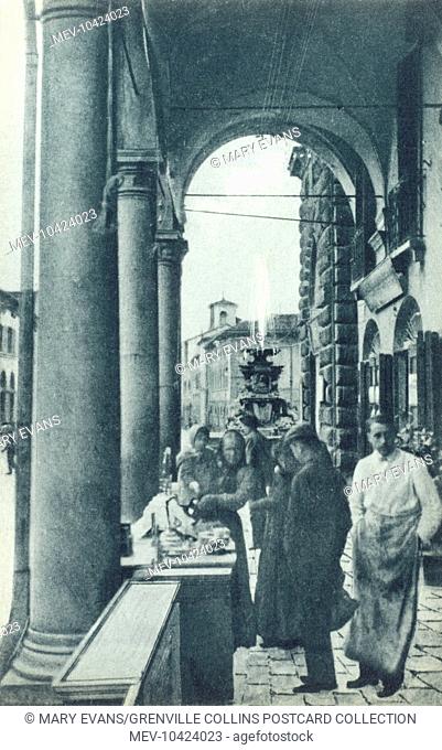 Faenza, Italy - Stalls under the arches of the Loggiato of the Palazzo Podesta on the Piazza del Popolo