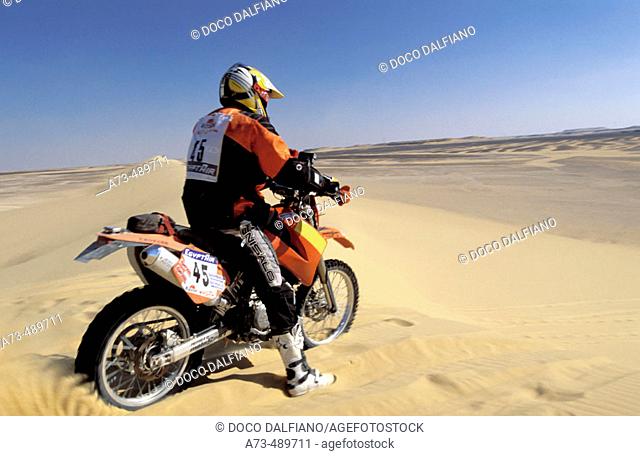 Rally des Pharaons 2003 Andrea Bona (KTM) racing on a sand dune along special stage 1 Cairo Baharija. Sahara. Western Desert. Egypt