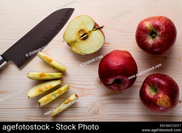 fresh red cut and sliced apple on cuttingboard