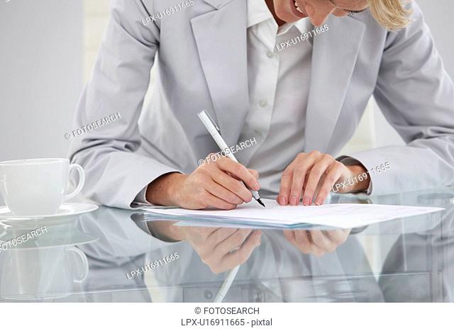 Girl signing a contract