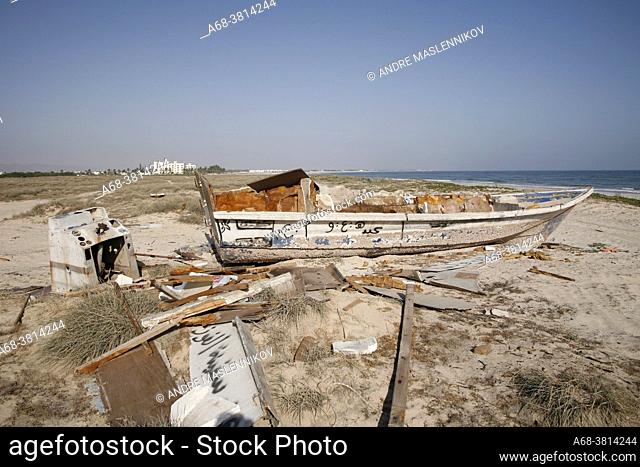 A wreck of a small fishing boat off the coast of Oman